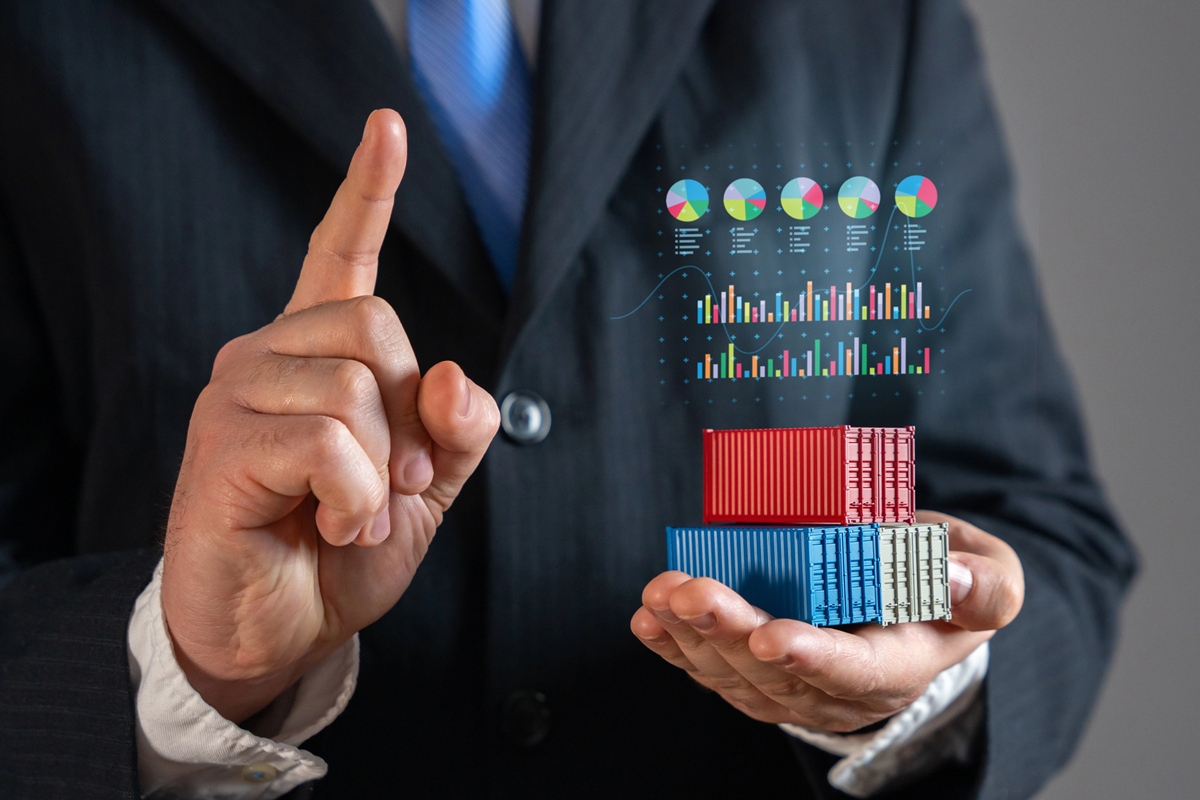 Businessman holding shipping containers against world trade map. Global trade, logistics, and commerce. Symbolizing international supply chains, exports, imports, and the expansion of global markets. Businessman holding shipping containers against world trade map. Global trade, logistics, and commerce. Symbolizing international supply chains, exports, imports, and the expansion of global markets.